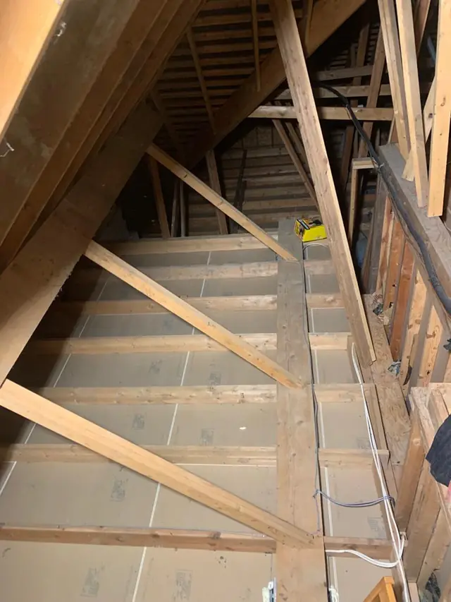 Attic vacuumed down to the drywall, ready for new insulation
