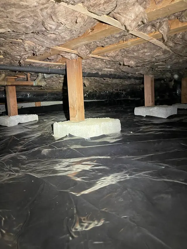 Vapor barrier installed around crawl space piers
