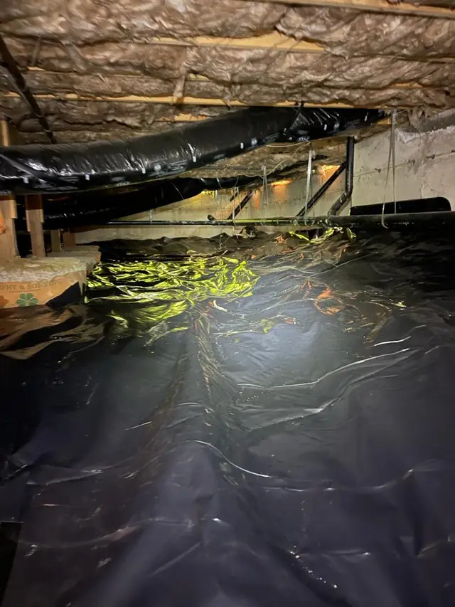 Finished vapor barrier running the length of the crawl space
