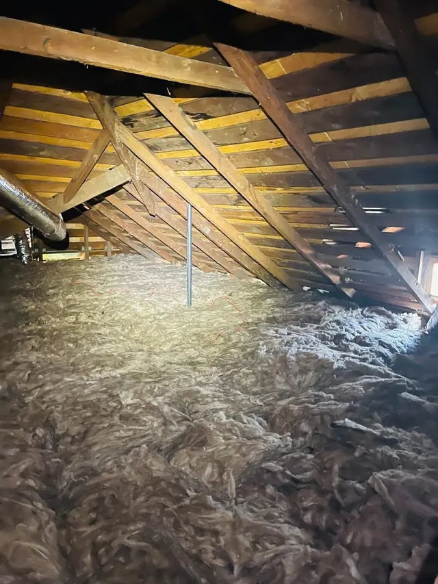 New blown-in insulation around a vent pipe