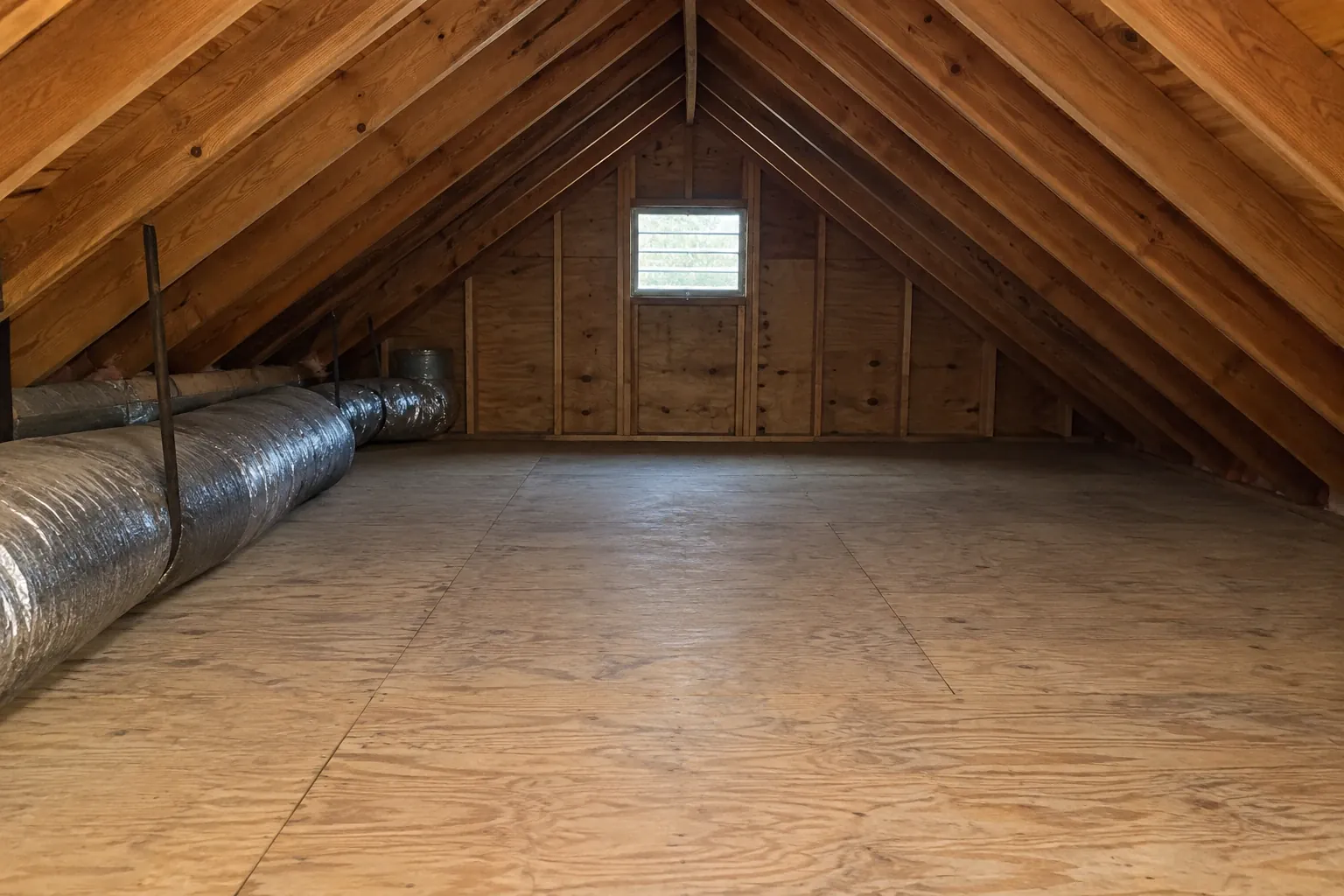 After: The attic cleanup is complete with all contamination removed and space fully sanitized, ready for future insulation or maintenance.