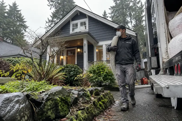 Crew at a Bellingham home with the insulation truck in the driveway.