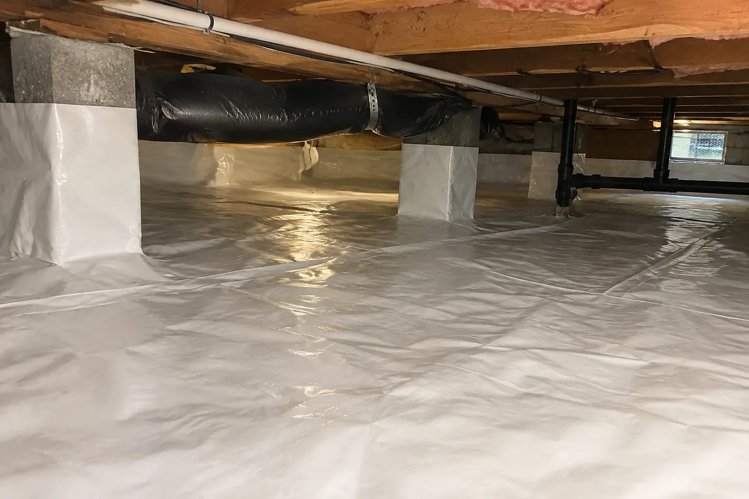 A brightly lit, freshly cleaned crawl space.