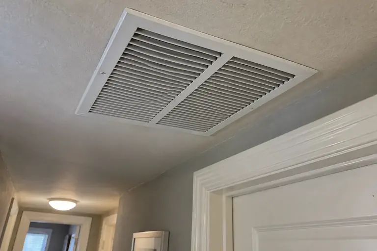 A clean ceiling return grille.
