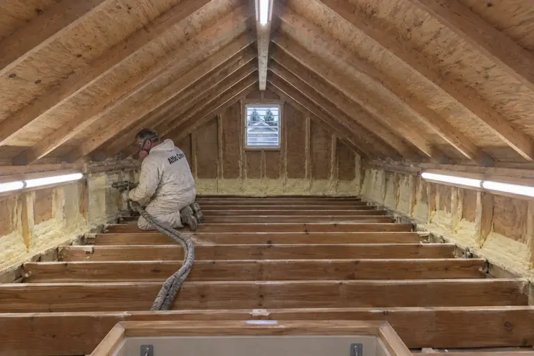 Spray foam insulation on an attic roof deck, in progress: The rim joists receive dense closed-cell foam insulation, sealing off drafts and.