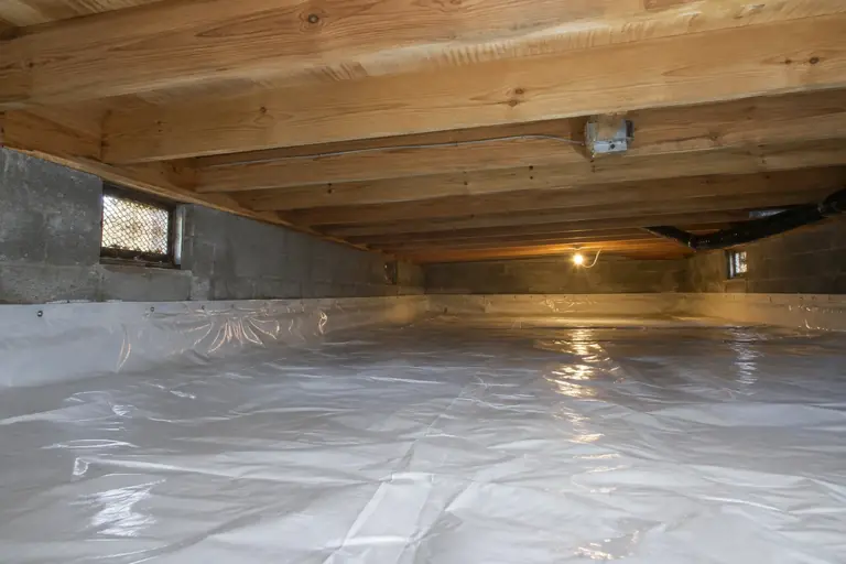 Mold remediation in Tacoma crawl space, after: Mold has been successfully remediated, and a new vapor barrier fully installed to prevent future moisture and mold growth in the crawl space.