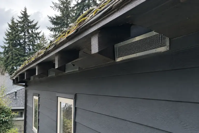 Rodent proofing the eaves of a Seattle Craftsman bungalow, after: Rodent entry points sealed completely, with all vents covered by sturdy mesh and flashing to protect the home.